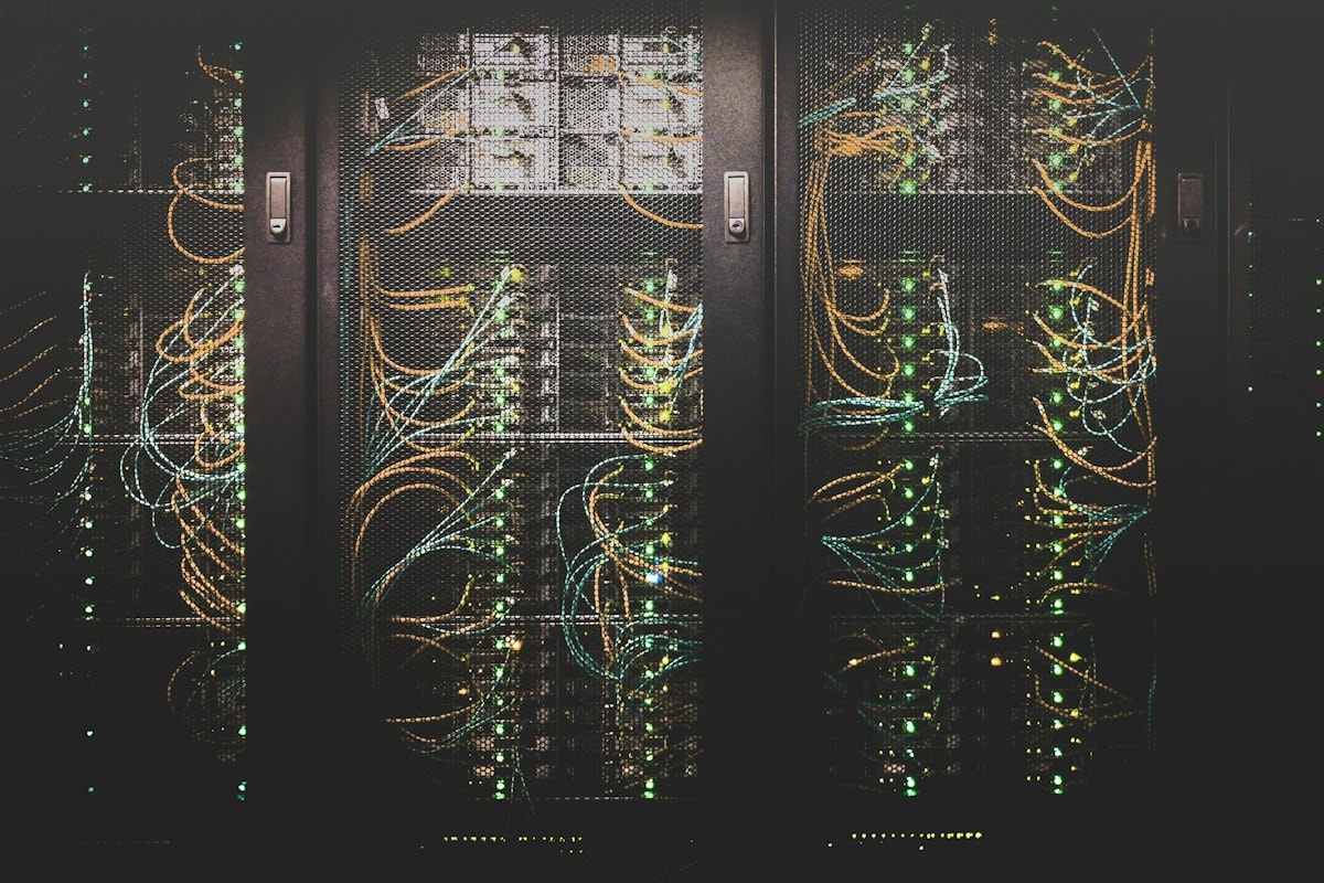 Rows of servers and network cables in a data center