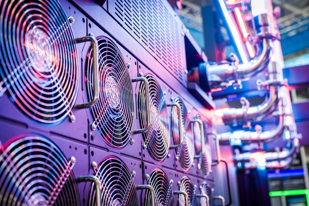 Rows of server fans glowing in a data center