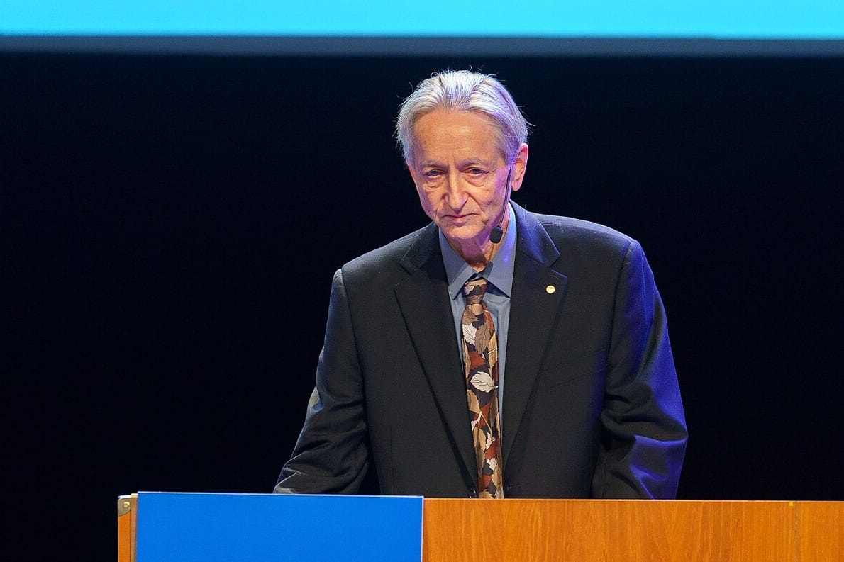 Geoffrey Hinton speaking at a podium during the 2024 Nobel lectures