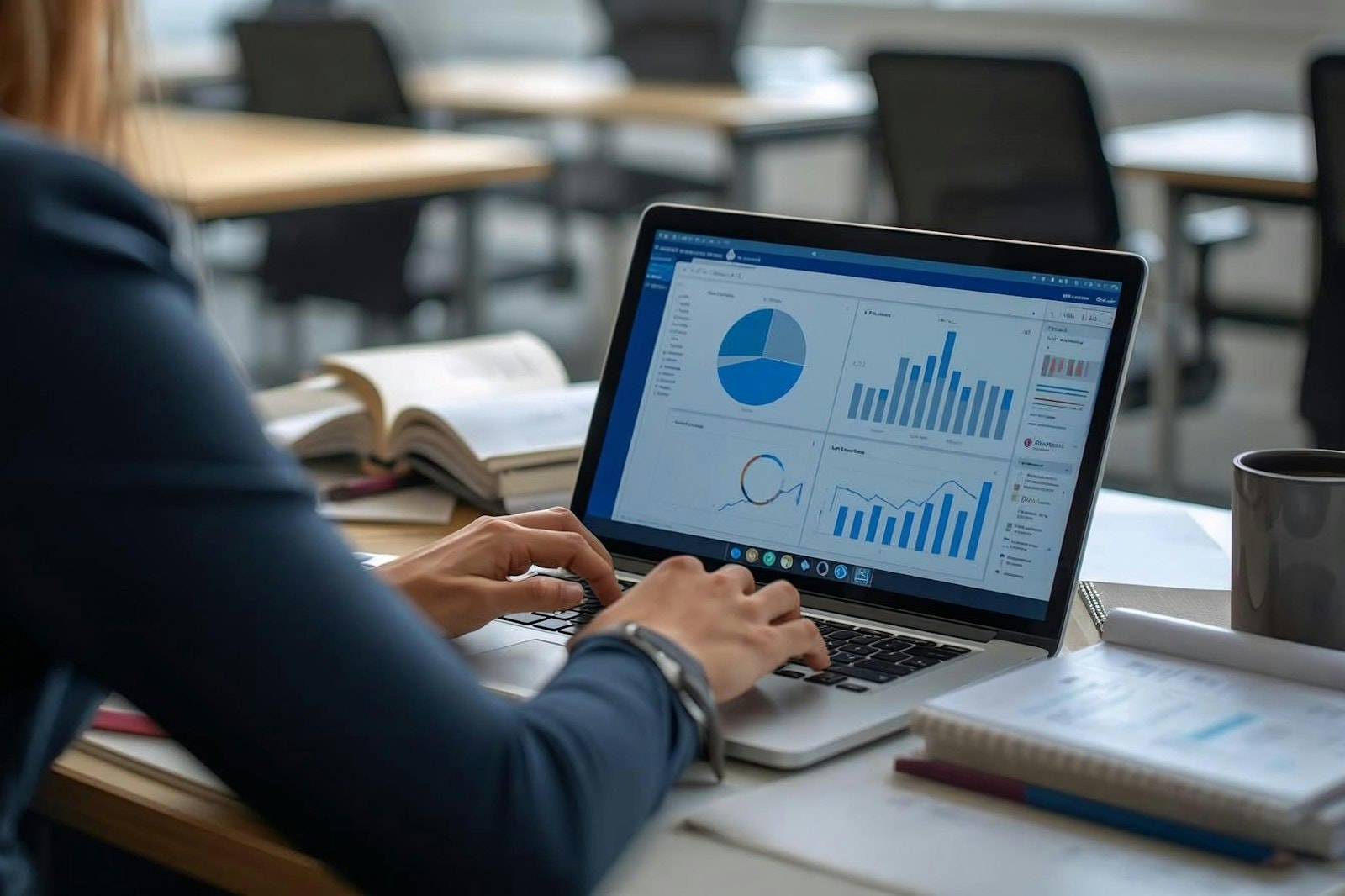 A media buyer reviewing charts on a laptop