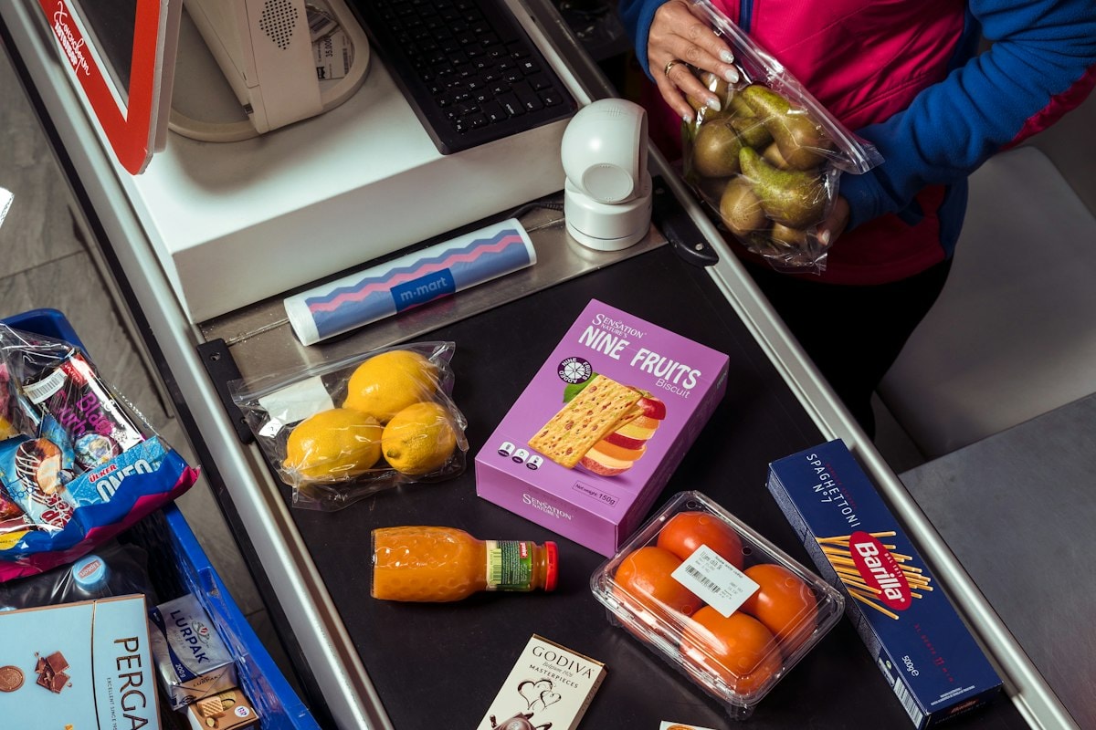 Groceries being scanned at a supermarket checkout