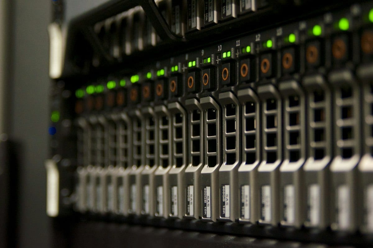 A server rack with rows of green status lights